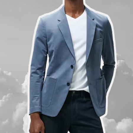 a model in a travel blazer on top of a cloud-like background
