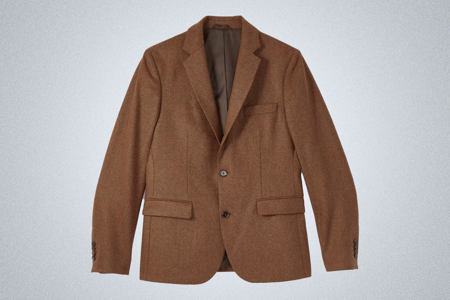 a brown Wills travel blazer on a grey background