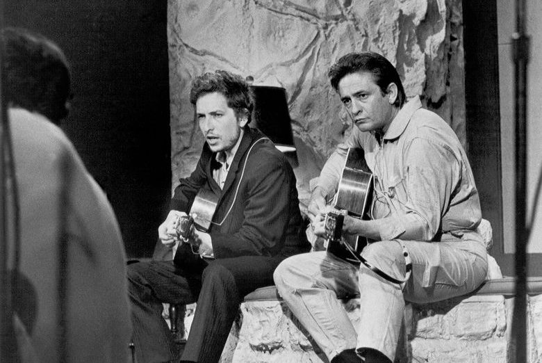 Bob Dylan and Johnny Cash perform together on 'The Johnny Cash Show' on June 7, 1969 in Nashville, Tennessee. (Photo by Michael Ochs Archives/Getty Images)