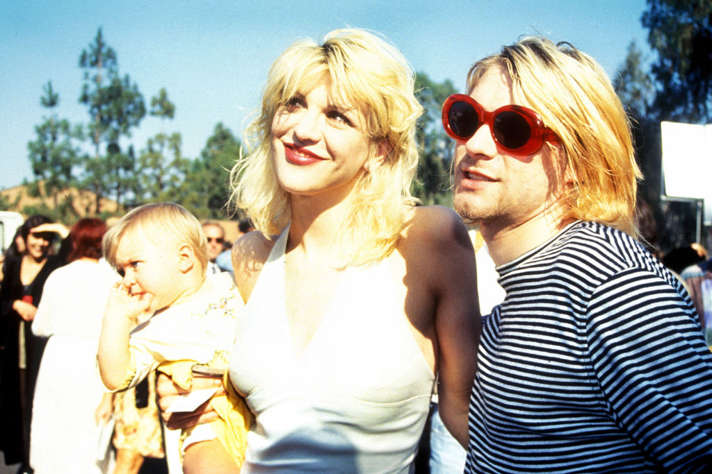Kurt Cobain with wife Courtney Love and daughter Frances Bean attending the 1993 MTV Video Music Awards. (Photo by Terry McGinnis/WireImage)