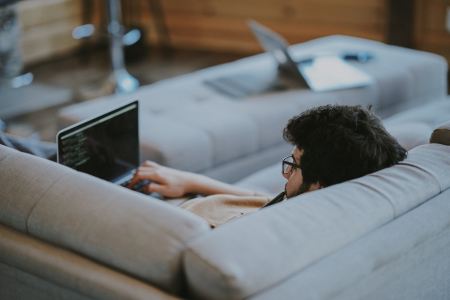 guy slouching on computer