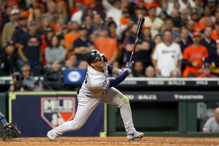 Gleyber Torres of the New York Yankees hits a two-RBI single against the Houston Astros during the seventh inning in game one of the American League Championship Series at Minute Maid Park on October 12, 2019 in Houston, Texas. (Photo by Bob Levey/Getty Images)