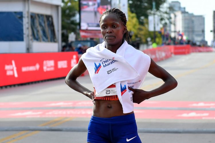 Brigid Kosgei of Kenya reacts after wining the 2019 Bank of America Chicago Marathon on October 13, 2019 in Chicago, Illinois. (Photo by Quinn Harris/Getty Images)