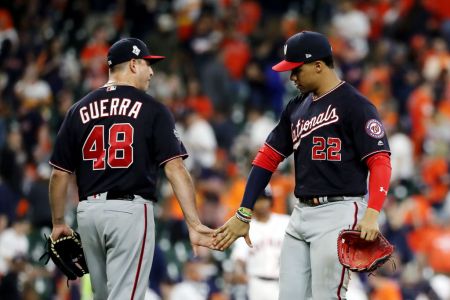 Juan Soto and Javy Guerra of the Washington Nationals celebrate their 12-3 win over the Houston Astros in Game Two of the 2019 World Series at Minute Maid Park on October 23, 2019 in Houston, Texas. (Photo by Elsa/Getty Images)