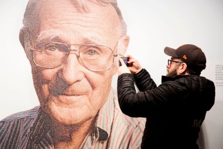 A visitor takes a mobile photo of a picture of Ingvar Kamprad, founder of Swedish multinational furniture retailer IKEA, at the IKEA museum in Almhult, Sweden, on January 28, 2018. (OLA TORKELSSON/AFP/Getty Images)