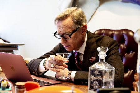 Paul Feig has a drink at his desk