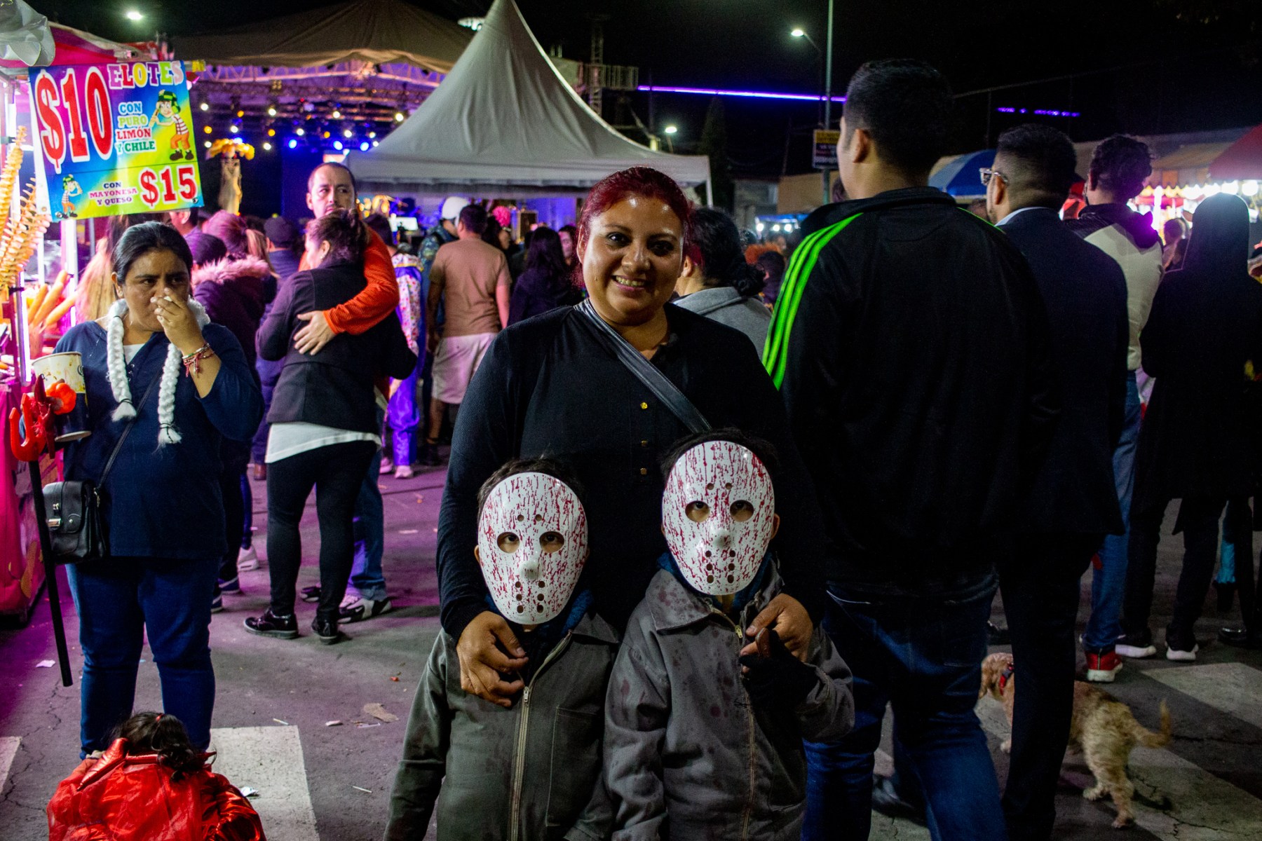 I don’t often ask people to pose for my photos, but I saw this mother leading her two children around in bloody hockey masks and couldn't resist.