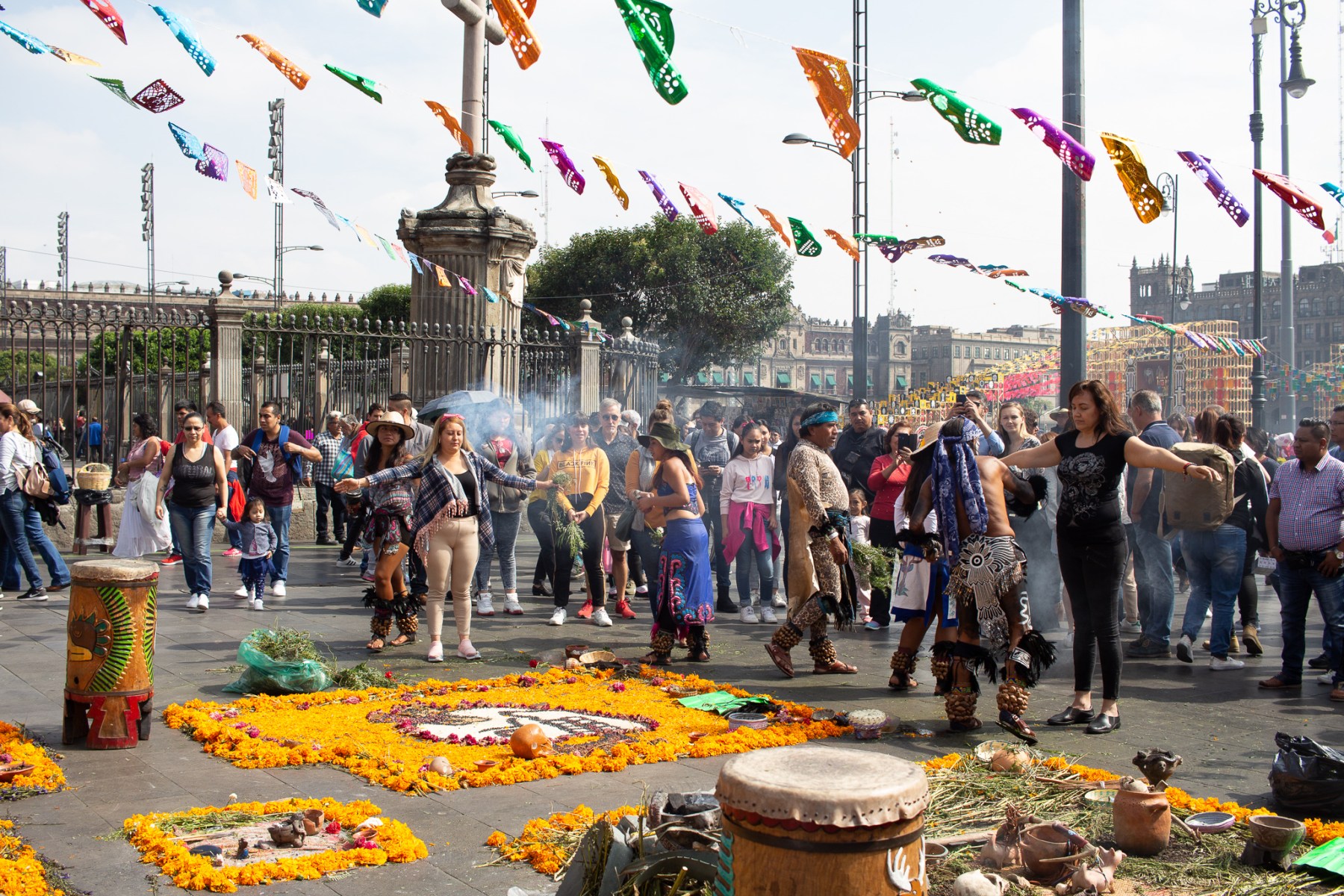 In the city center, indigenous groups perform purifying rituals for locals and tourists alike for a small fee. In the background, giant ofrendas in the main square (El Zócalo) are visited by thousands. 