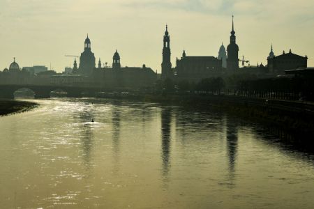 Saxony, Dresden: The silhouette of the old town is reflected in the morning in foggy weather in the Elbe.  (Photo by Jens Kalaene/picture alliance via Getty Images)