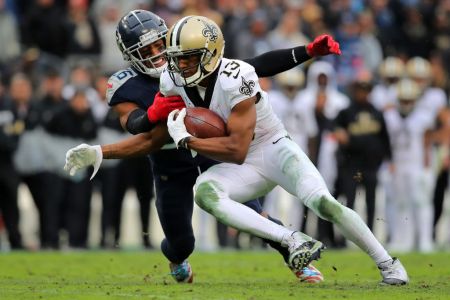 Wide receiver Michael Thomas of the New Orleans Saints makes a pass reception as cornerback Logan Ryan of the Tennessee Titans tackles during the third quarter in the game at Nissan Stadium on December 22, 2019 in Nashville, Tennessee. (Photo by Brett Carlsen/Getty Images)