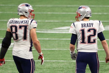 Rob Gronkowski talks with Tom Brady at Super Bowl LIII. (Mike Ehrmann/Getty)