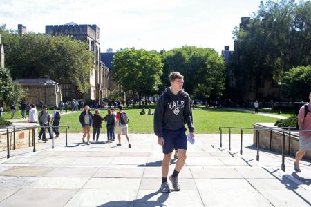 Students walk through the campus of Yale University (Photo by Yana Paskova/Getty Images)