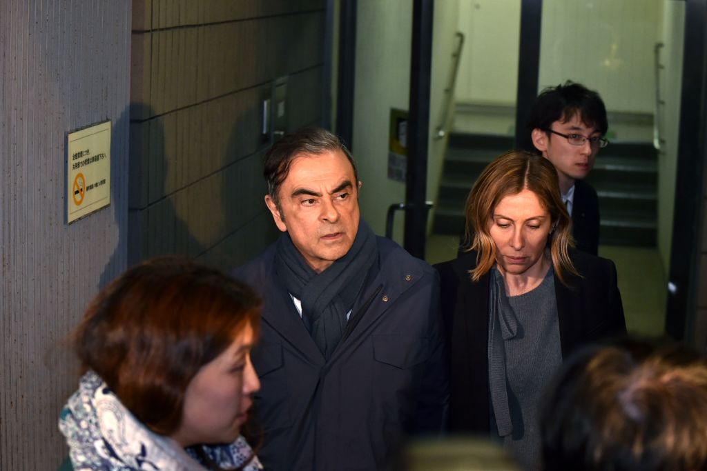Former Nissan Chairman Carlos Ghosn and his wife Carole leave the office of his lawyer Junichiro Hironaka in Tokyo on April 3, 2019. (Photo by Kazuhiro NOGI / AFP)