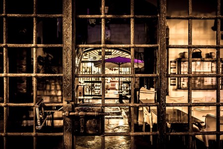 Locked gate, restaurant beyond