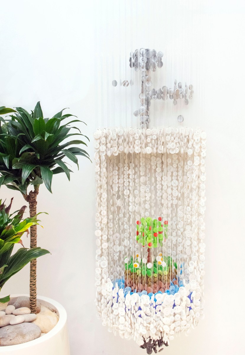 Urinal sculpture made entirely of buttons by artist Agusto Esquivel. “What makes me laugh is the flower growing in the middle,” Grutman says.