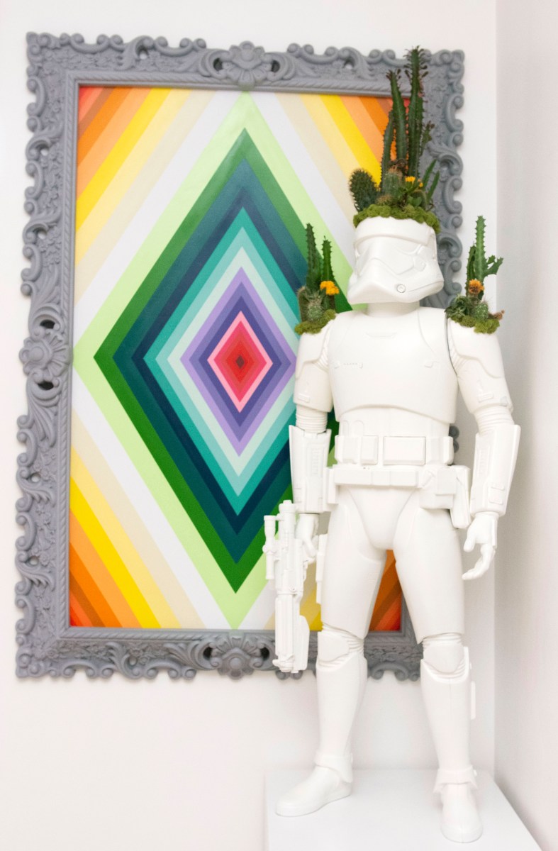 A stormtrooper accented with tiny cacti, by Miami design firm Plant the Future, also hangs out near Grutman’s kitchen.