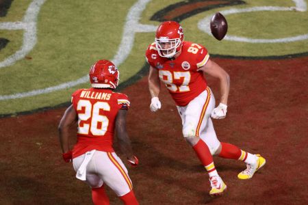 Travis Kelce of the Kansas City Chiefs celebrates with teammates after scoring a touchdown against the San Francisco 49ers during the fourth quarter in Super Bowl LIV at Hard Rock Stadium on February 02, 2020 in Miami, Florida. (Photo by Elsa/Getty Images)