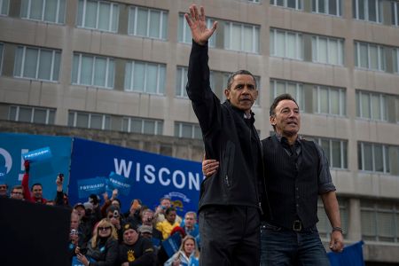 President Barack Obama alongside Bruce Springsteen waves to the crowd during a campaign stop in Madison, Wisconsin, on Monday, November 5, 2012. (Photo by Nikki Kahn/The Washington Post via Getty Images)