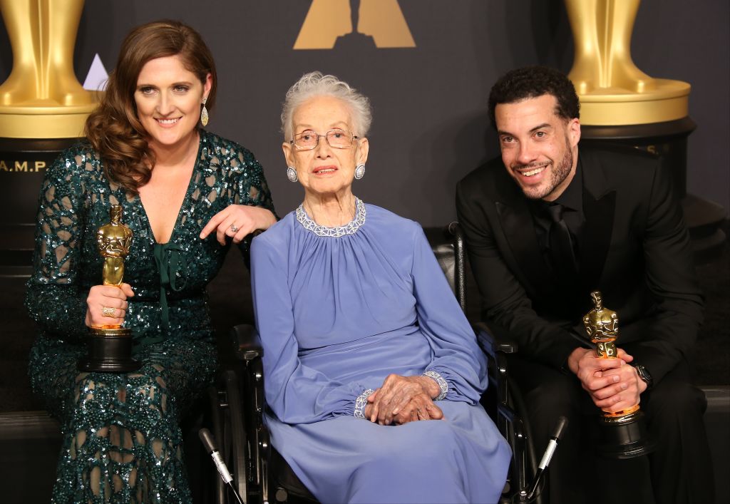NASA mathematician Katherine Johnson (C) and director Ezra Edelman (R) and producer Caroline Waterlow (L), winners of Best Documentary Feature for 'O.J.: Made in America' pose in the press room at the 89th Annual Academy Awards in Hollywood, California. (Photo by Dan MacMedan/Getty Images)