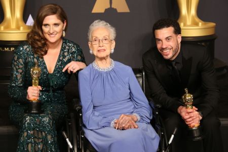 NASA mathematician Katherine Johnson (C) and director Ezra Edelman (R) and producer Caroline Waterlow (L), winners of Best Documentary Feature for 'O.J.: Made in America' pose in the press room at the 89th Annual Academy Awards in Hollywood, California. (Photo by Dan MacMedan/Getty Images)