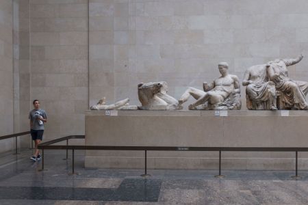 A visitor walks around the Parthenon (Elgin) Marbles in Room 18 of the British Museum, on 12th June 2018, in London, England.  (Photo by Richard Baker / In Pictures via Getty Images Images)