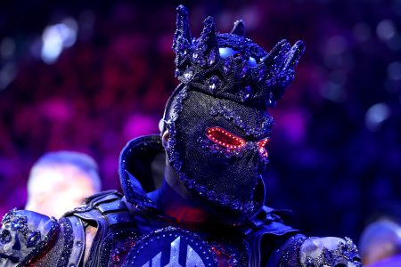 Heavyweight Champ Blames 40-Pound Costume For Dead Legs in TKO Loss