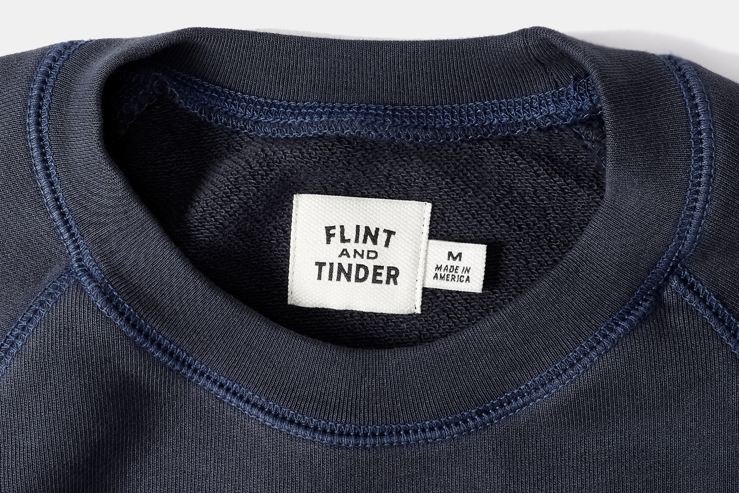 Navy crewneck sweatshirt tag