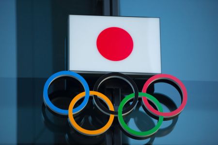 Japanese National Flag over the Olympic Rings symbol is seen