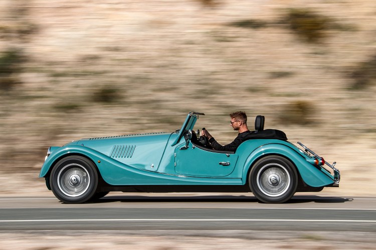 Two-seat roadster car driving