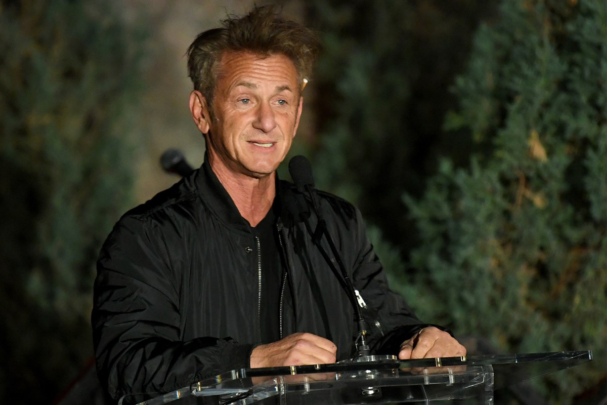 Actor Sean Penn standing at a podium