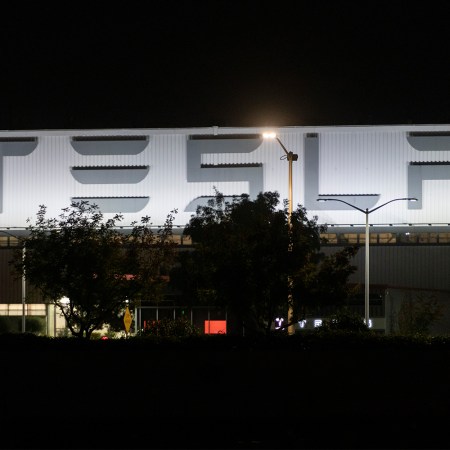 The exterior of Tesla's Fremont factory at night
