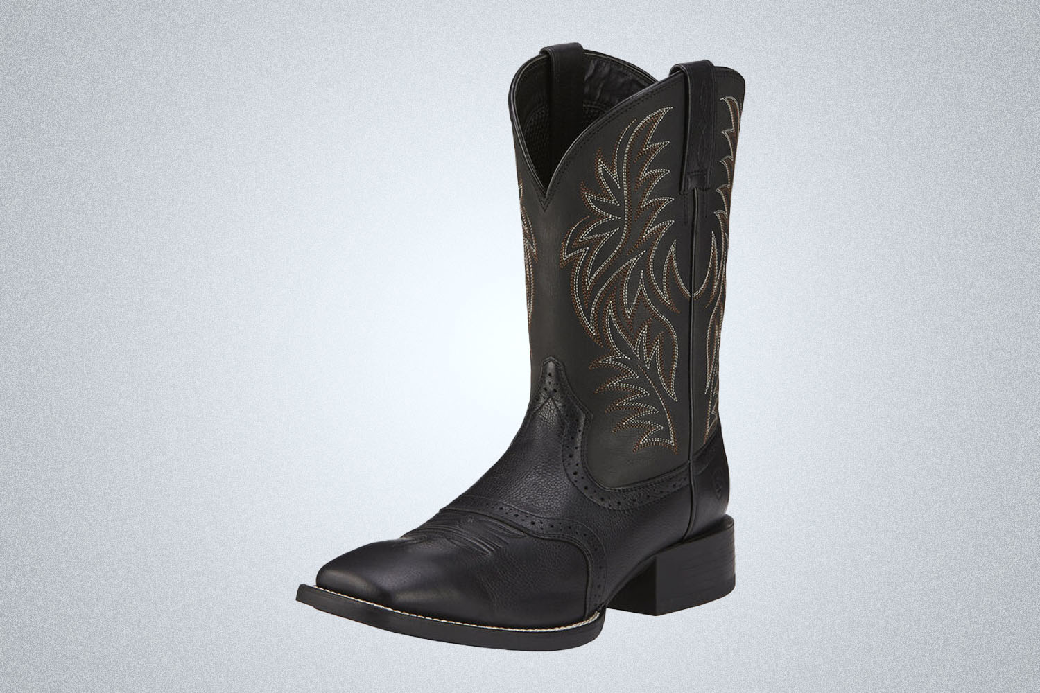 a leather Ariat western boot on a grey background