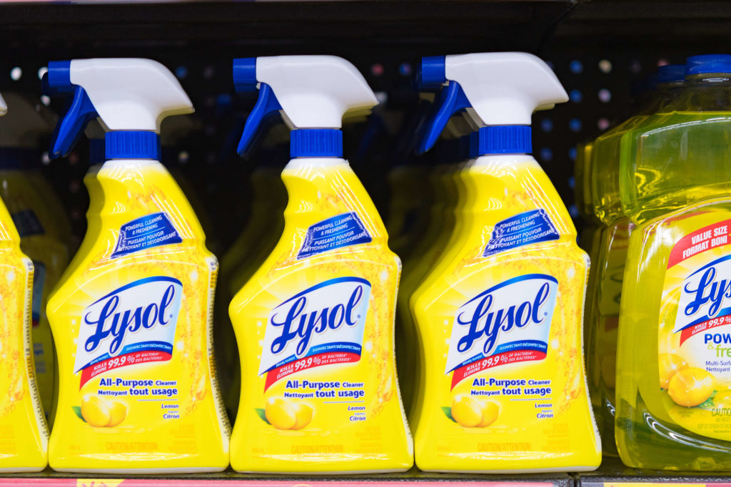 Lysol bottles on a store shelf, plastic spray bottles of all-purpose cleaner