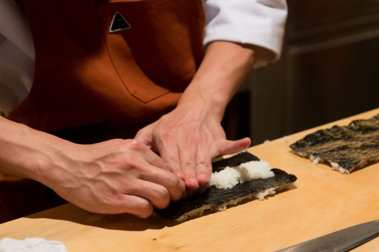 A view of food being prepared during a dinner with Masa Takayama (Photo by Noam Galai/Getty Images)