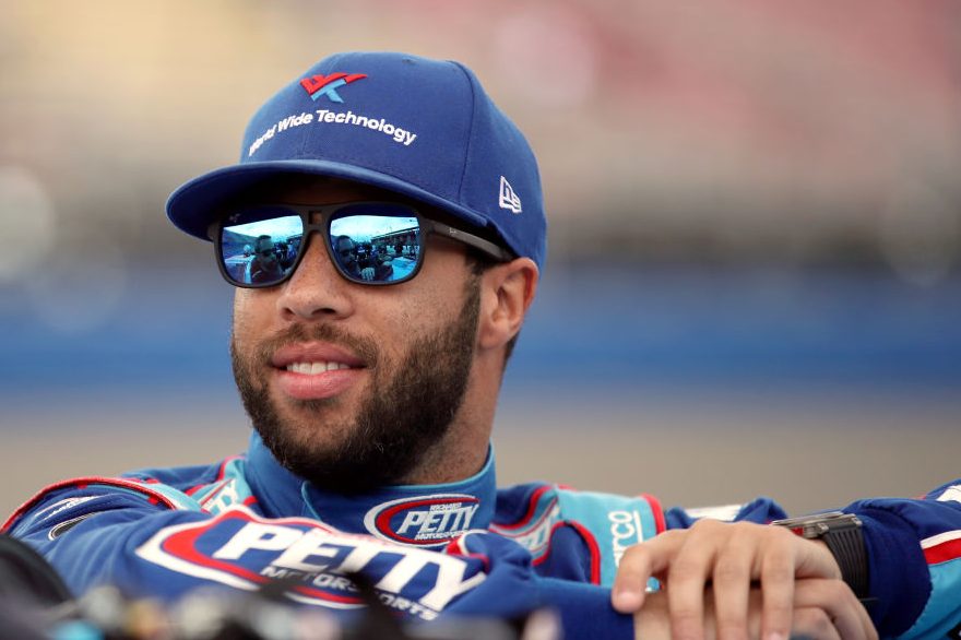Bubba Wallace, driver of the #43 Victory Junction Chevrolet, stands by his car. (Katelyn Mulcahy/Getty)