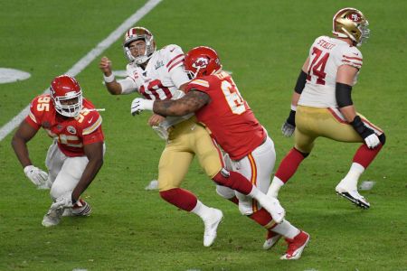 Mike Pennel of the Chiefs puts pressure on quarterback Jimmy Garoppolo of the 49ers. (Focus on Sport/Getty)