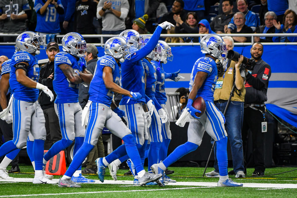 Detroit Lions cornerback Amani Oruwariye celebrates an interception with his teammates. (Steven King/Icon Sportswire via Getty)