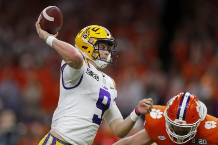 Joe Burrow throws the ball under pressure against Clemson. (Jonathan Bachman/Getty Images)