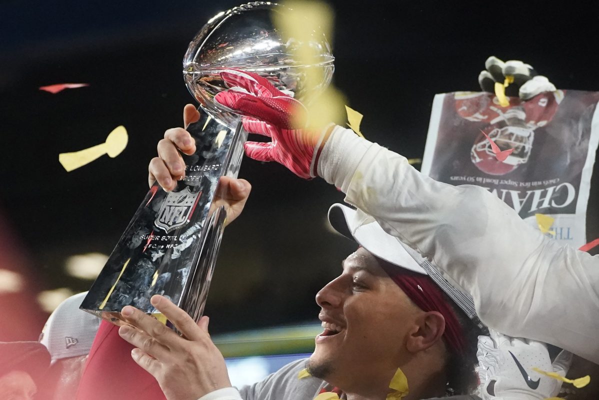 Quarterback Patrick Mahomes holds up the Vince Lombardi Trophy (TIMOTHY A. CLARY/AFP via Getty)