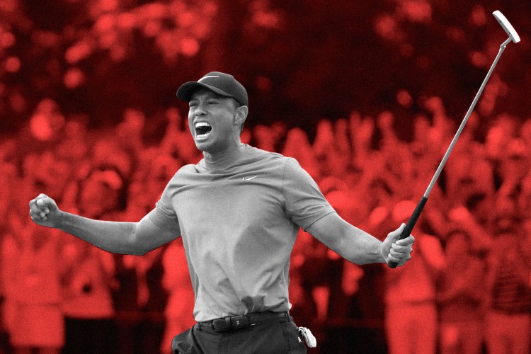 Tiger Woods celebrates on the 18th green after winning the Masters in 2019.