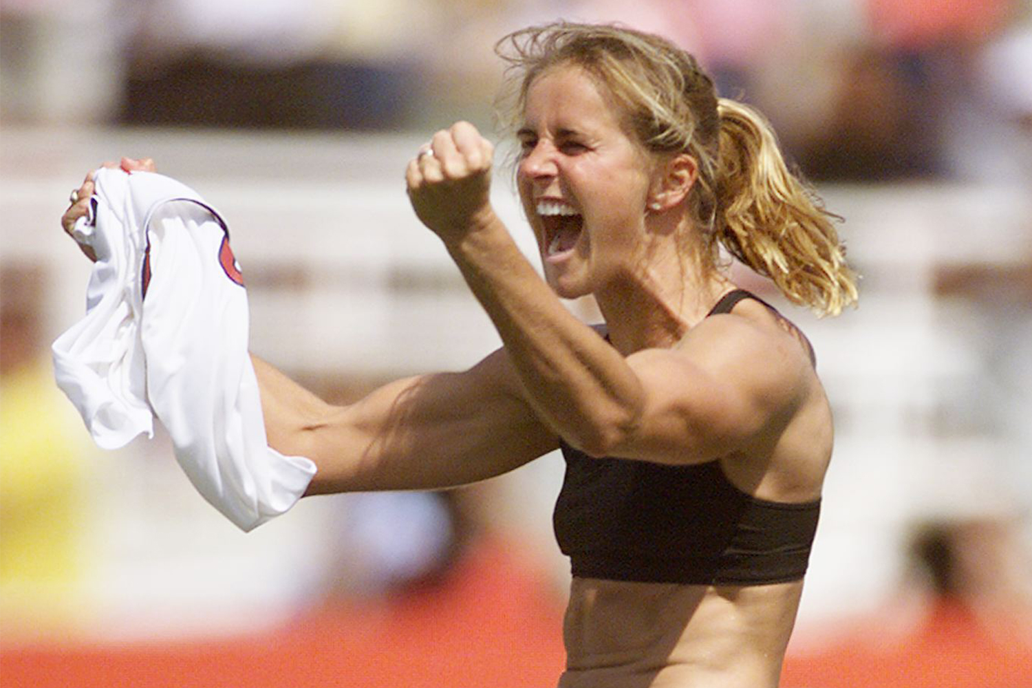 Brandi Chastain of the U.S. celebrates after scoring the winning penalty ki...