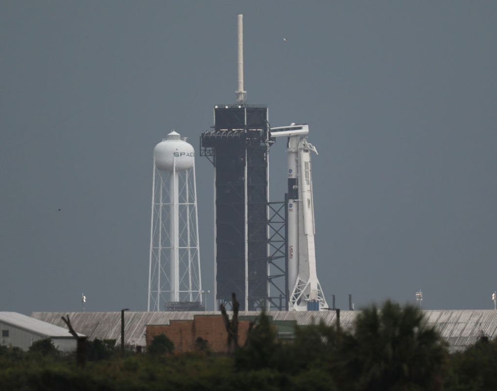 The SpaceX Falcon 9 rocket with the Crew Dragon spacecraft attached sits on launch pad 39A at the Kennedy Space Center on May 27, 2020 in Cape Canaveral, Florida. Later today NASA astronauts Bob Behnken and Doug Hurley are scheduled to liftoff on an inaugural flight and will be the first people since the end of the Space Shuttle program in 2011 to be launched into space from the United States.  (Photo by Joe Raedle/Getty Images)