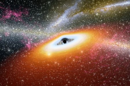 This artist's conception illustrates one of the most primitive supermassive black holes known (central black dot) at the core of a young, star-rich galaxy. (Photo by: Photo12/Universal Images Group via Getty Images)