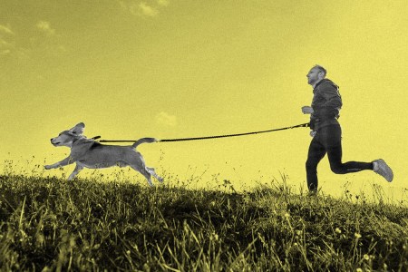 man running with dog