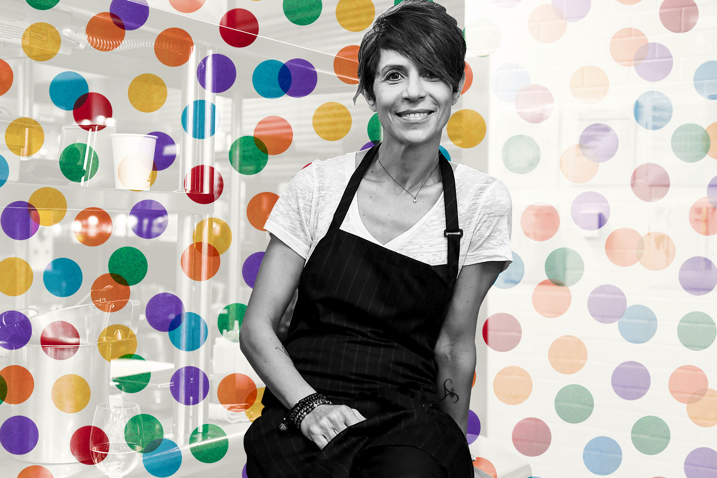 Dominique Crenn stands in front of a polka dot background