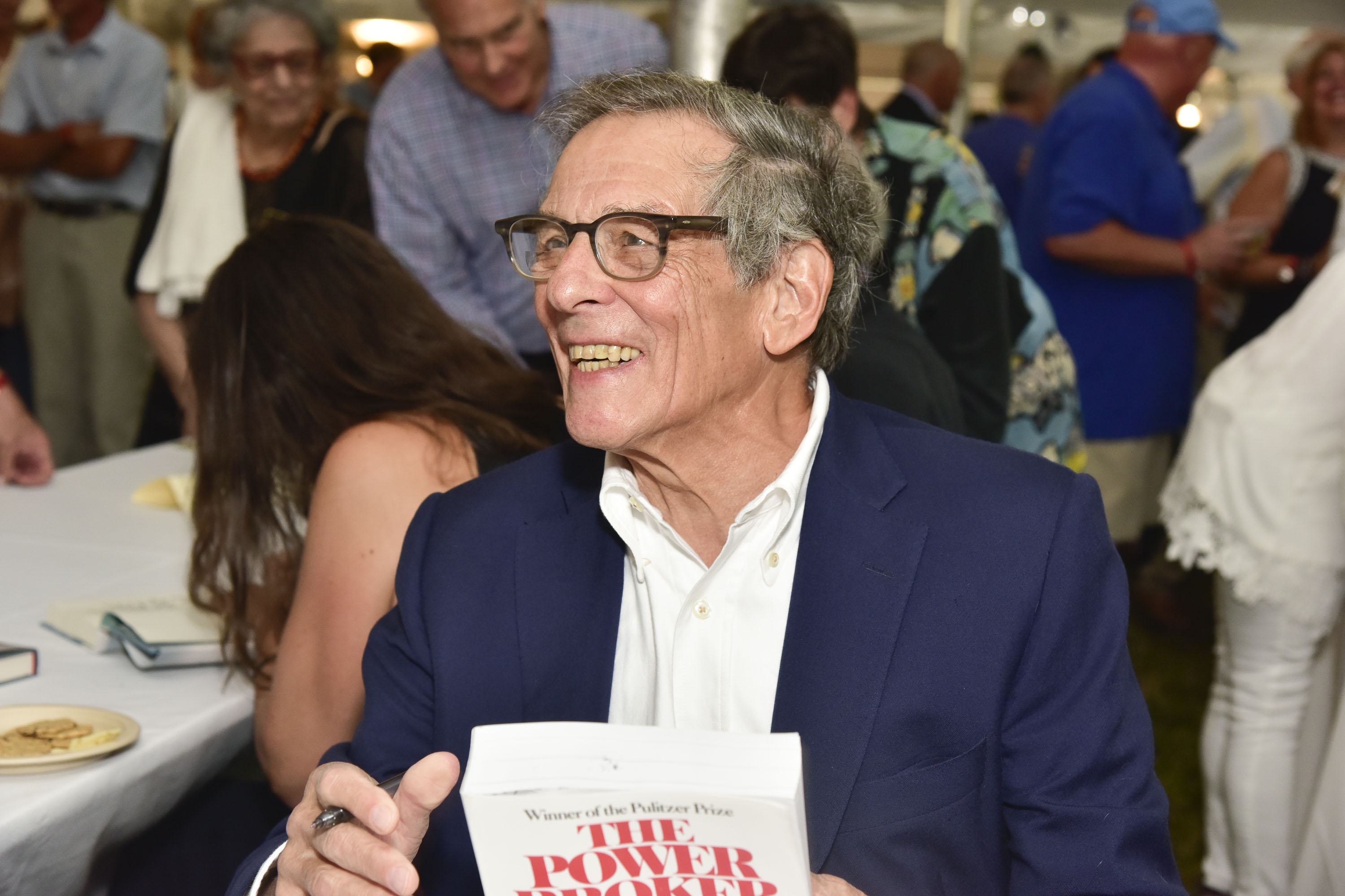 Author Robert Caro with his book "The Power Broker"