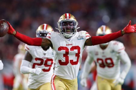 Tarvarius Moore of 49ers celebrates after intercepting a pass by Patrick Mahomes. 