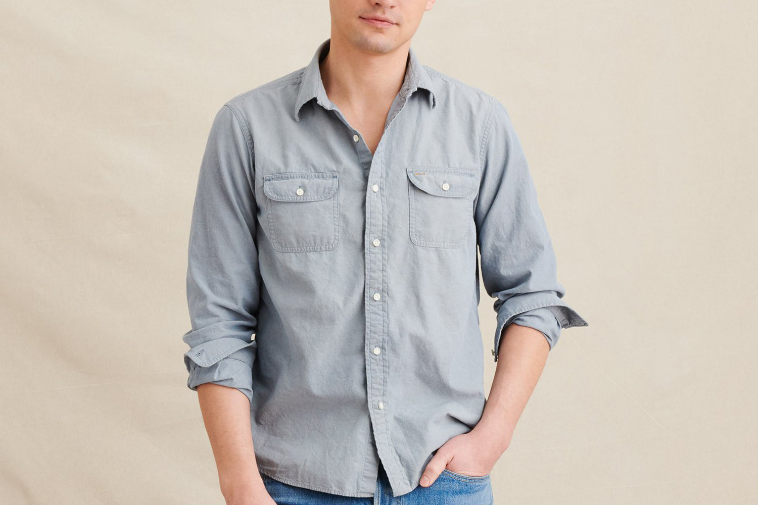 Man wearing Alex Mill's chambray chore shirt