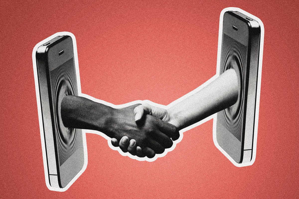 Two hands shake through phone screens