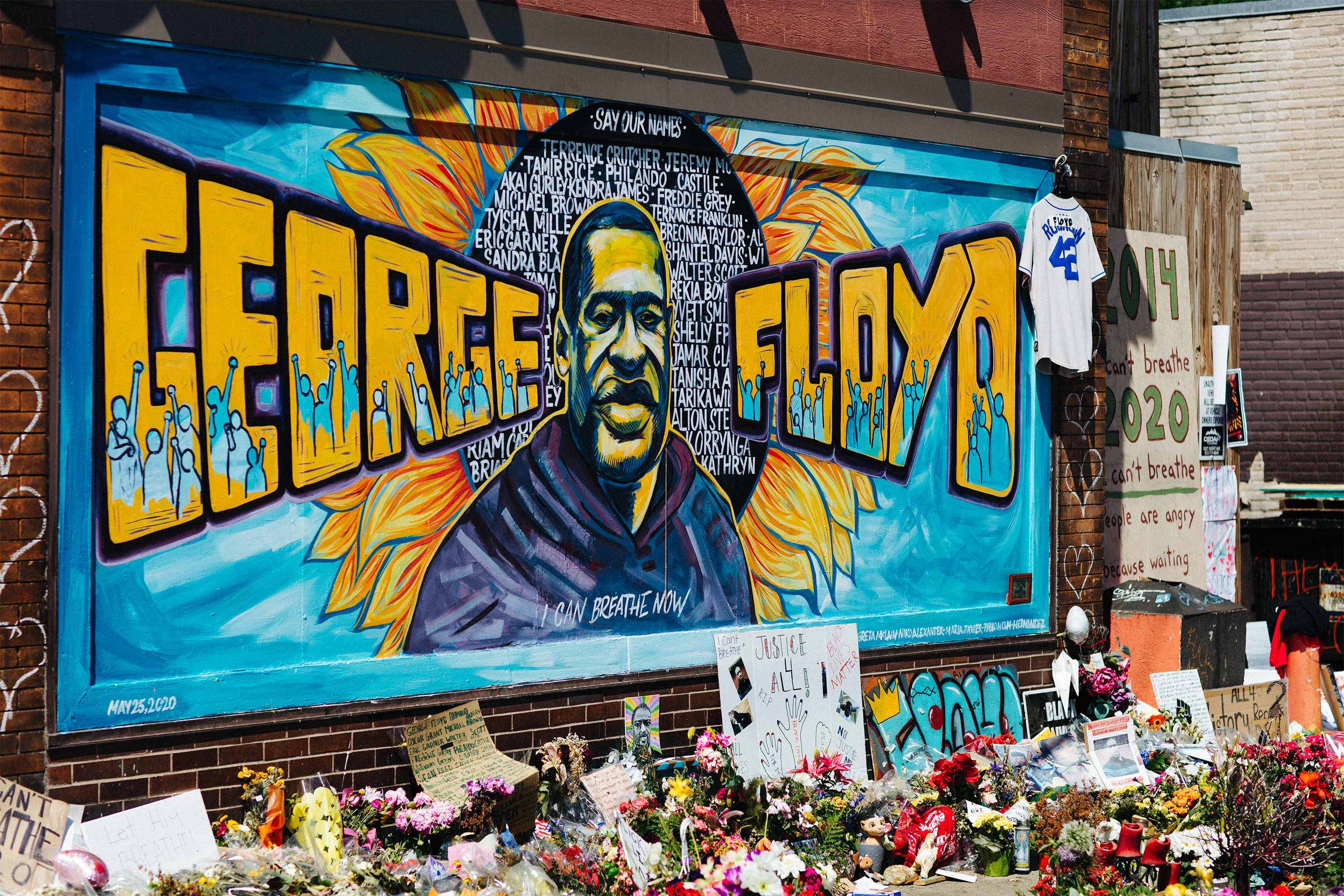 Blue and yellow mural of George Floyd outside Cup Foods in Minneapolis